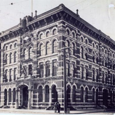 An old building with a clock on the front.