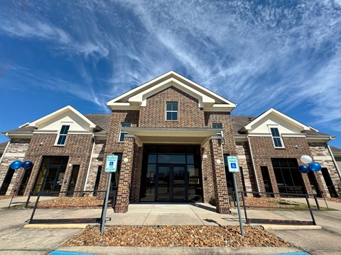 A building with a brick facade and a large entrance.