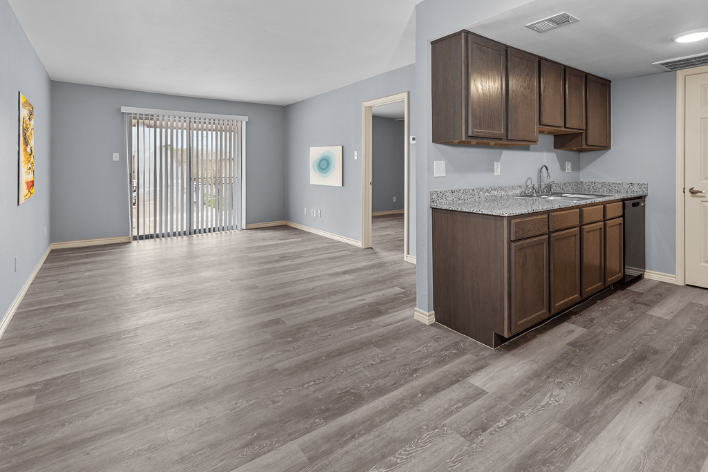 a kitchen and living room in a new home