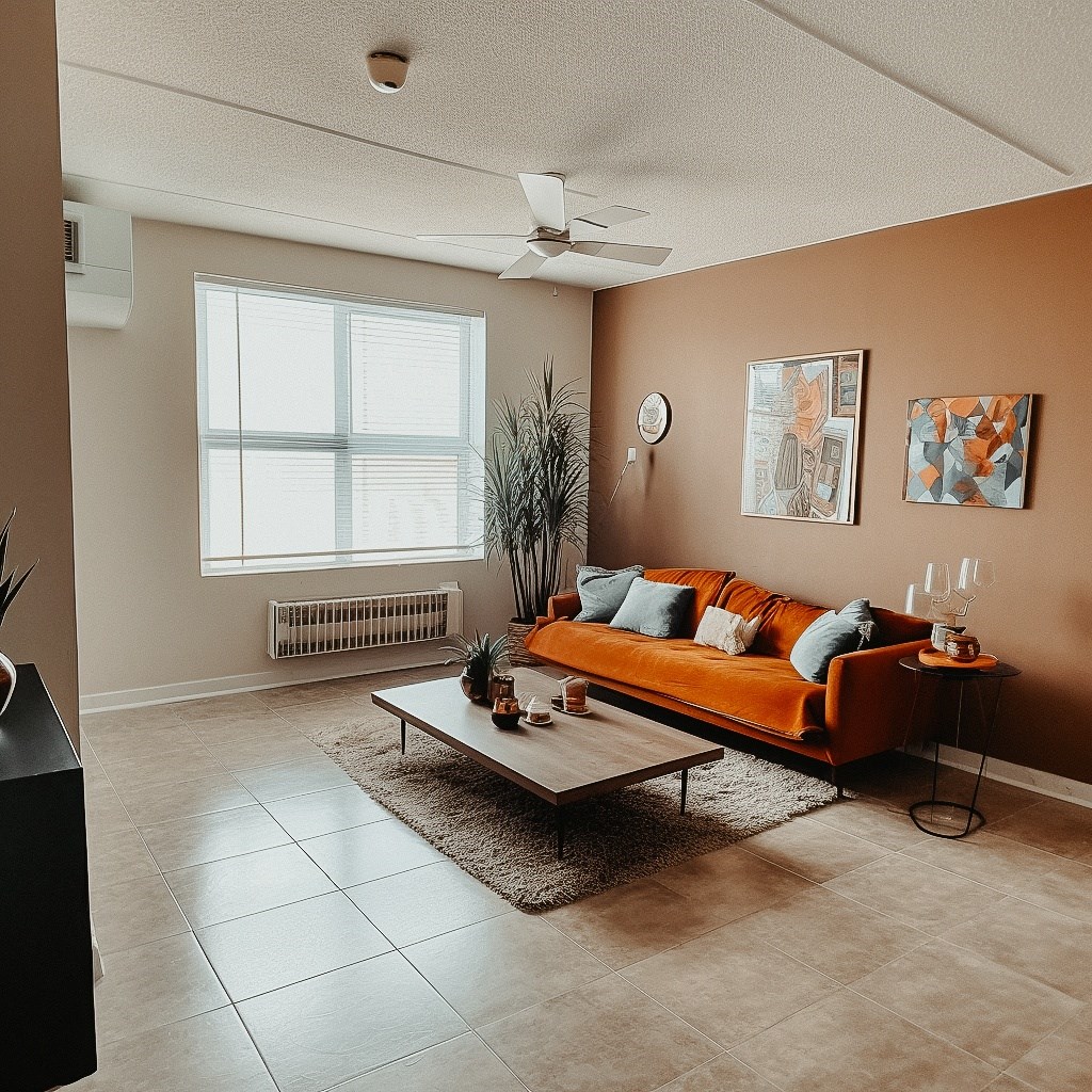 a living room with an orange couch and a coffee table