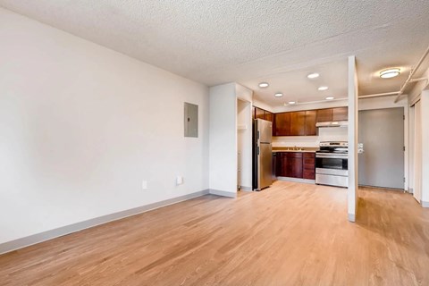A room with wooden floors and white walls.