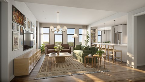 A modern living room with a green couch and a wooden floor.