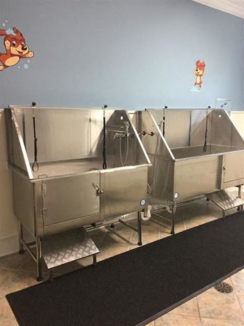 a group of stainless steel sinks in a room at Remington Apartment Homes, Romeoville, Illinois