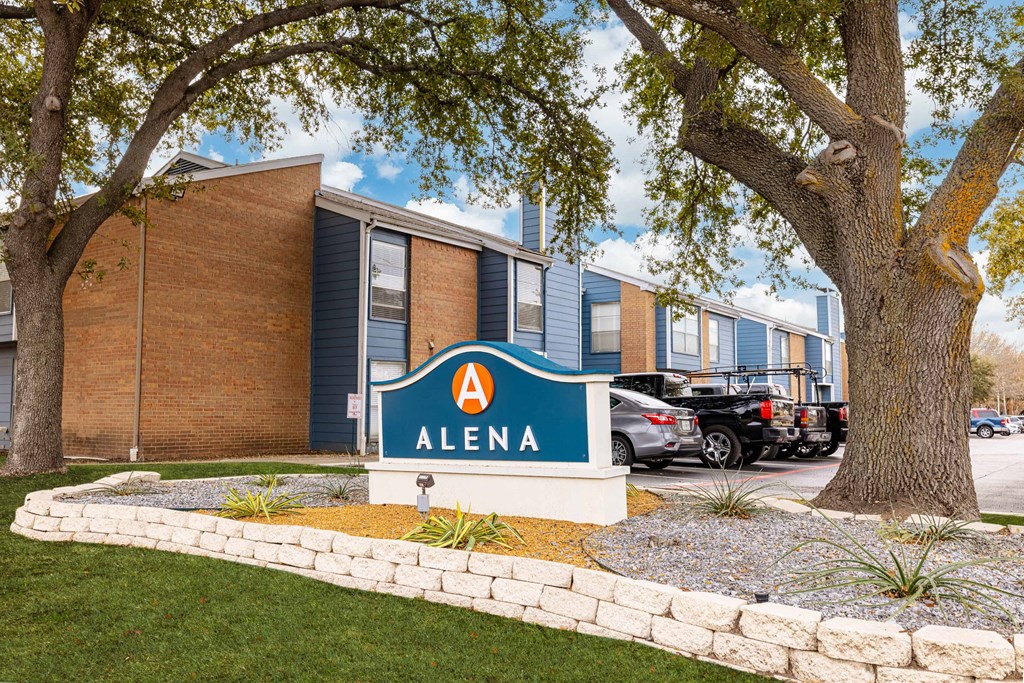 A sign that says Alena in front of a building.