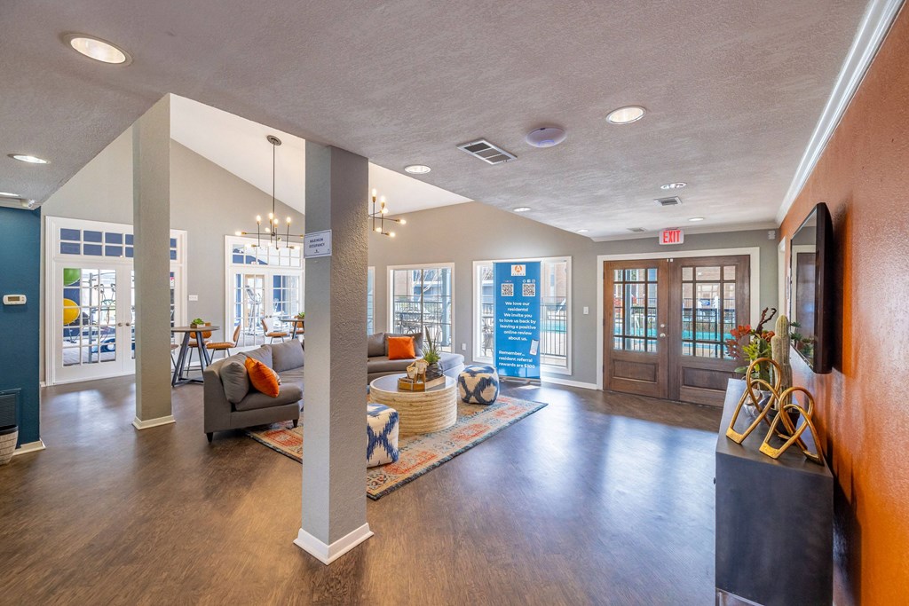 A spacious lobby with a blue wall and a white column.