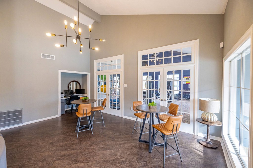 A room with a table and chairs in it.