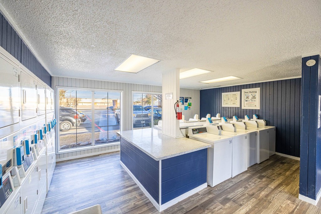 A clean and well-organized dental office with a view of the parking lot outside.