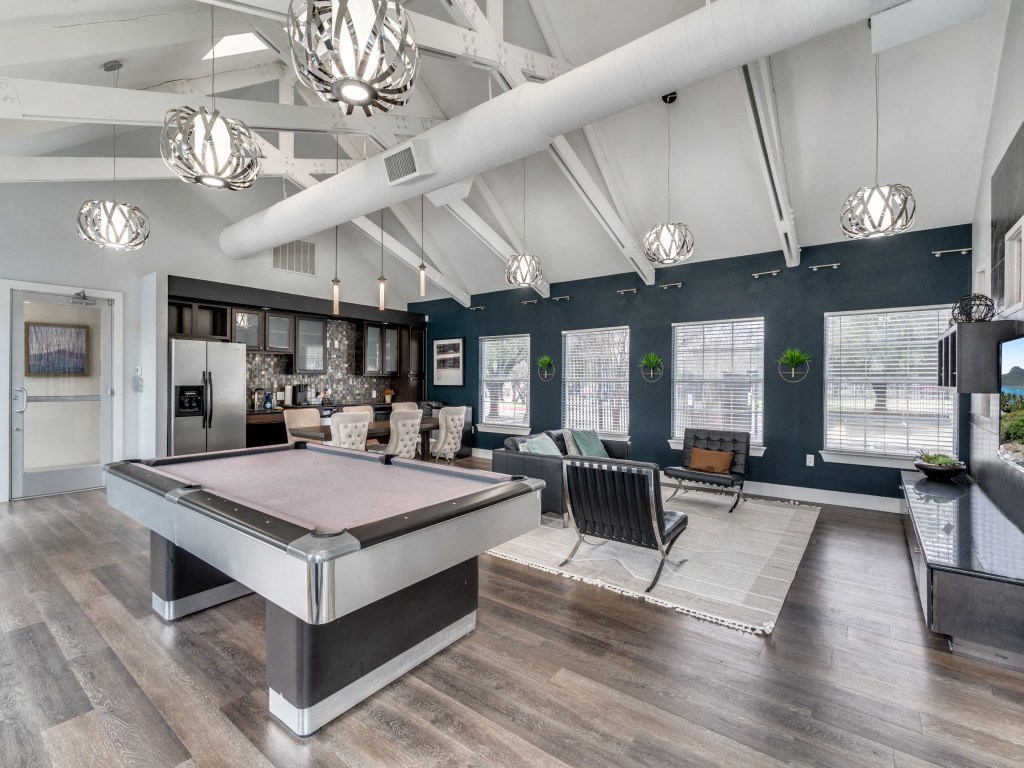 clubhouse with pool table at the district flats apartments in lenexa clubhouse with pool table at the district flats apartments in lenexa at Vibe on Riverside, Austin, Texas