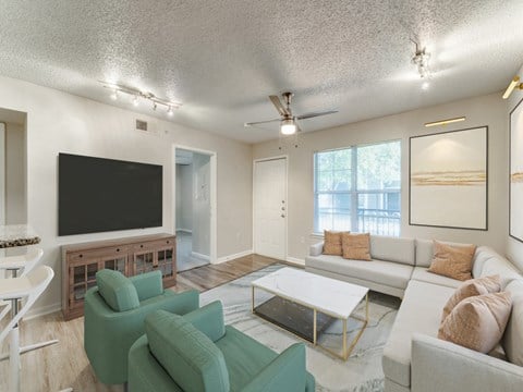 a living room with a couch and a coffee table  at Vibe on Riverside, Austin