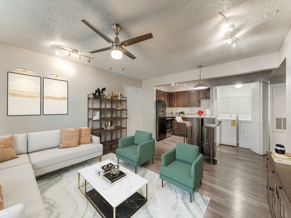 an open living room and kitchen with a ceiling fan an open living room and kitchen with a ceiling fan  at Vibe on Riverside, Austin, TX, 78741