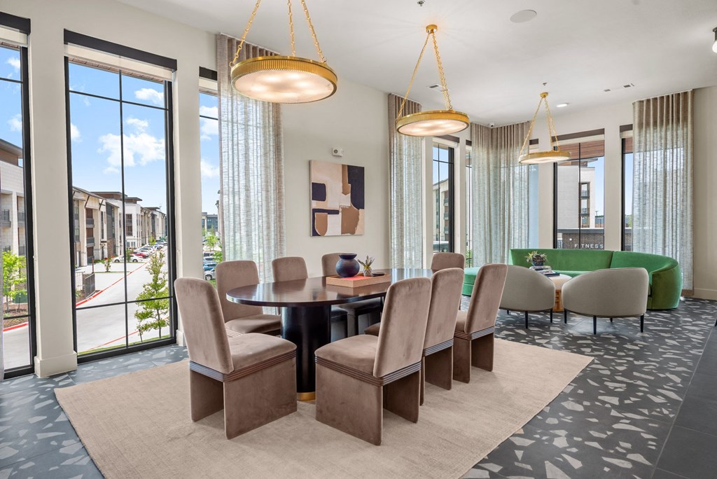 a dining room with a table and chairs