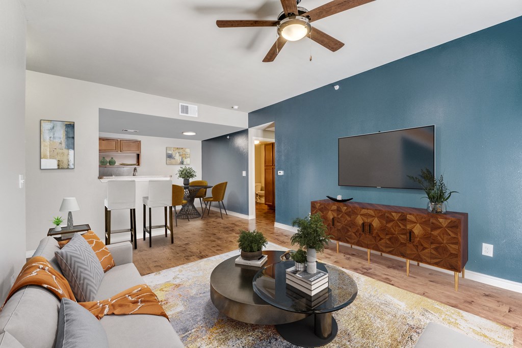 a living room with a couch and a coffee table  at Valor at Harlingen, Harlingen