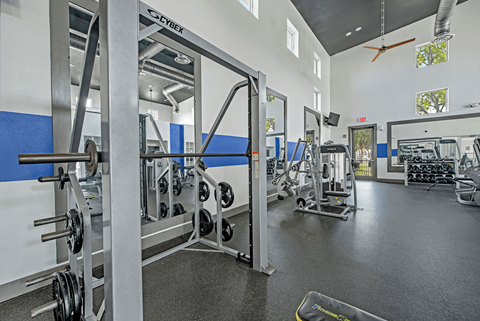A gym with a weightlifting area.