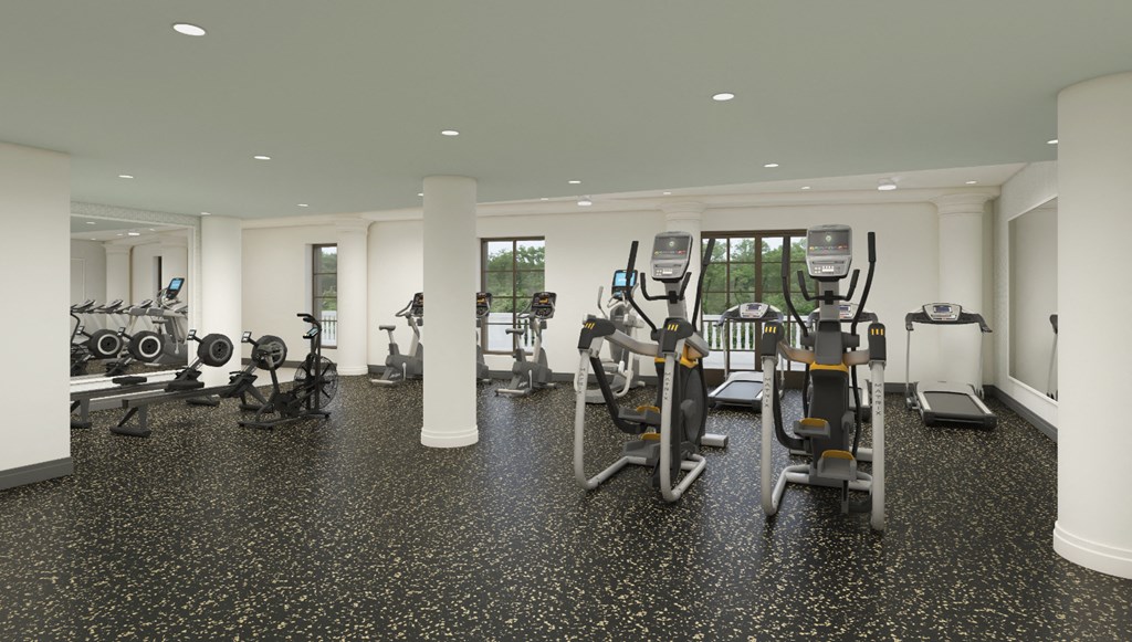 a gym with cardio equipment and weights in a building