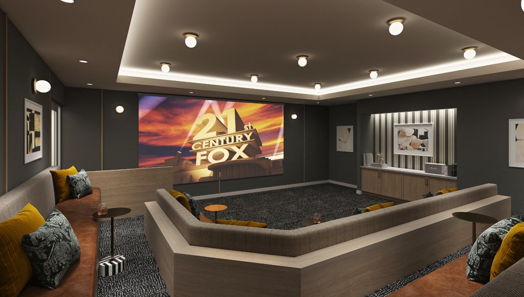a rendering of a movie room with a couch and a tv