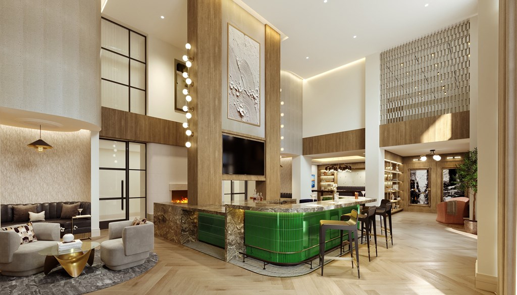 A modern living room with a green sofa and a fireplace.