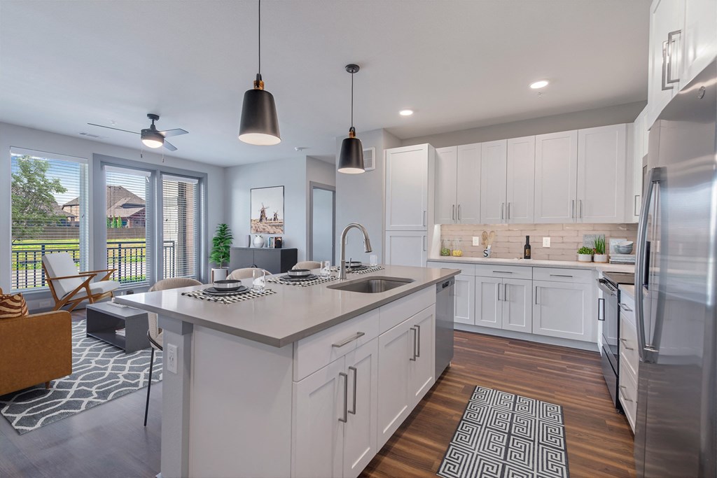 kitchen with white cabinets and large windows