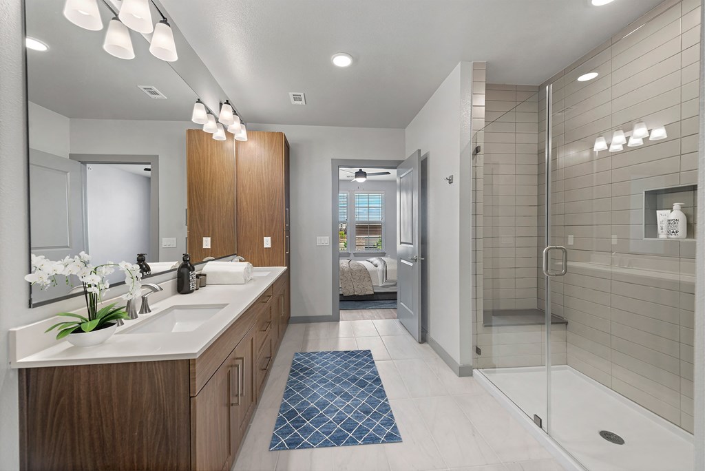 a bathroom with a shower and a sink