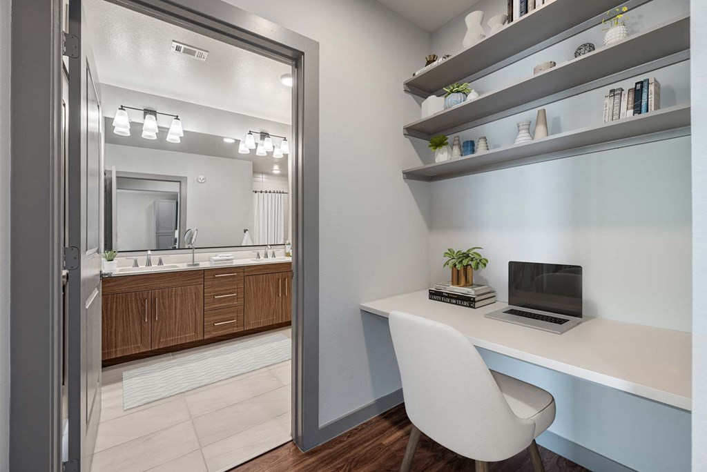 a home office with a desk and a chair