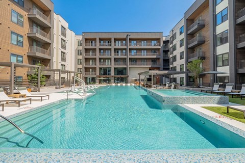 A large indoor swimming pool in a residential building.