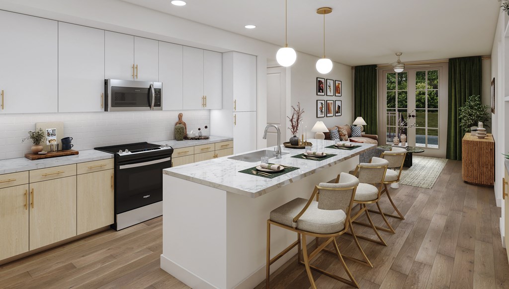 a kitchen and dining room with white cabinets and a marble counter top