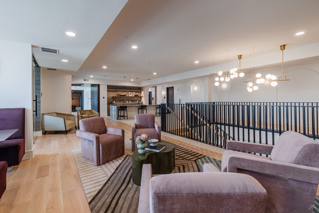 A large room with a long table and chairs.