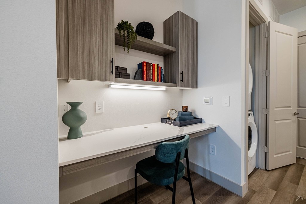 A small room with a desk and a chair.