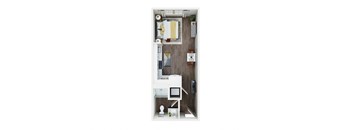 A small room with a bed, desk, and chair.