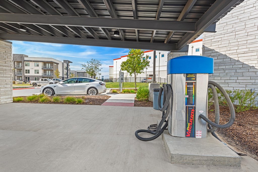 a gas station with a car in the background  at Presidium Revelstoke, Fort Worth, 76131