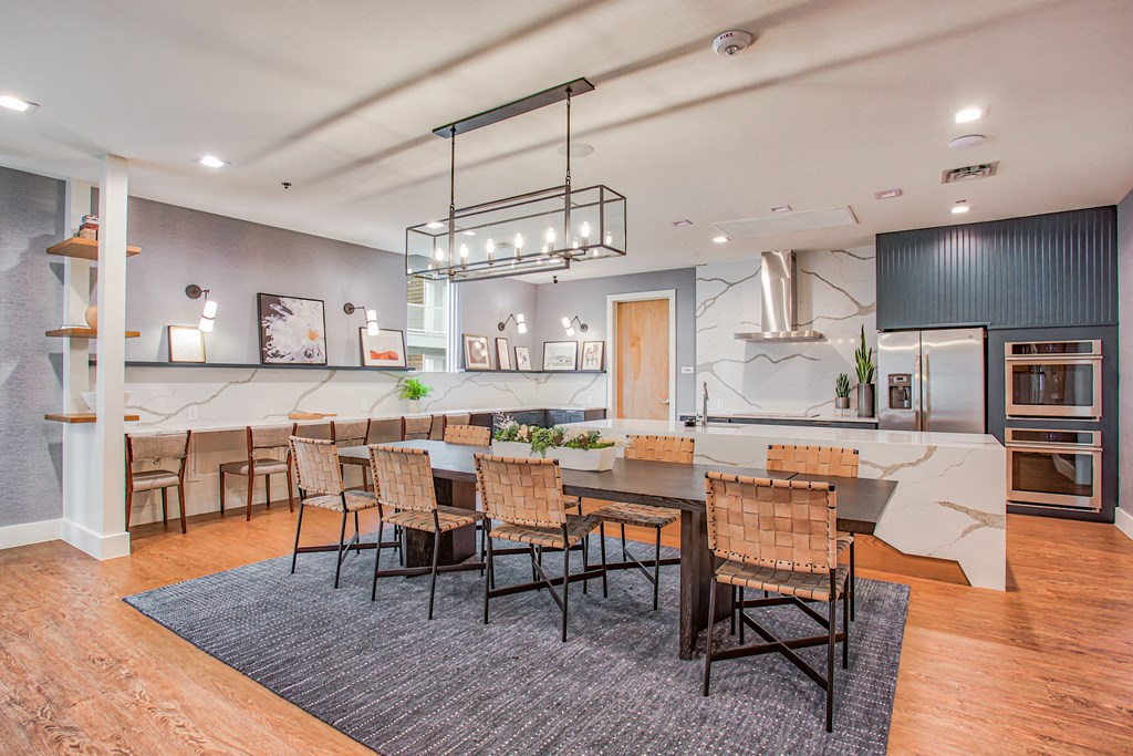a large kitchen and dining room with a table and chairs  at Presidium Revelstoke, Fort Worth, TX, 76131