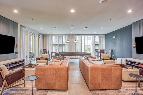 a living room with couches and chairs and a television  at Presidium Revelstoke, Fort Worth, Texas