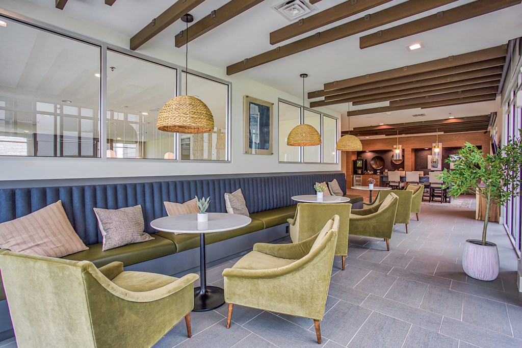 the lobby of a restaurant with couches and chairs  at Presidium Revelstoke, Fort Worth, TX, 76131