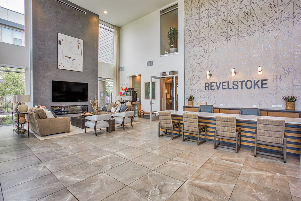 the lobby of the revelstoke with a lobby sign and a reception desk  at Presidium Revelstoke, Fort Worth, TX