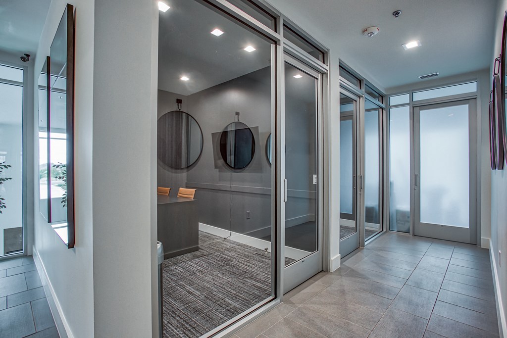 a large walk in closet with mirrors and a desk  at Presidium Revelstoke, Fort Worth, TX