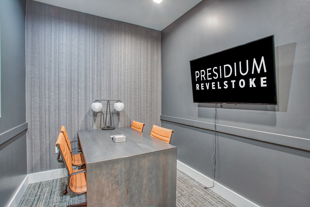 a room with a desk and chairs  at Presidium Revelstoke, Fort Worth, TX, 76131