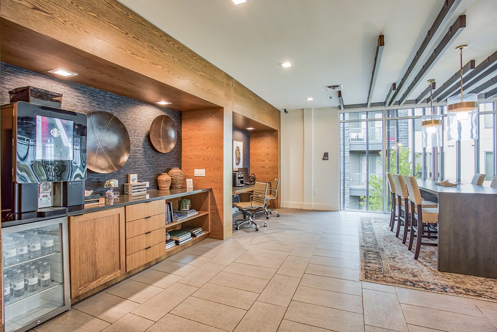 a room with a desk and chairs and a large window  at Presidium Revelstoke, Fort Worth, TX, 76131