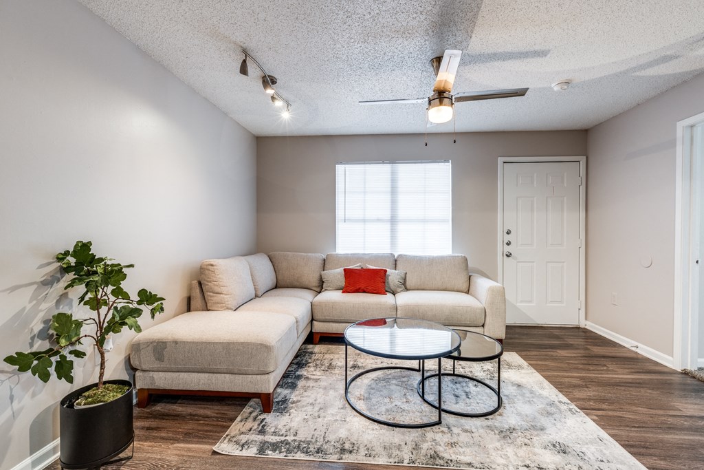 a living room with a couch and a coffee table at Vibe on Riverside, Austin, TX