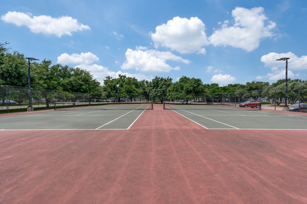 the tennis courts are clean and ready for players to play at Vibe on Riverside, Austin