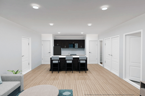A modern kitchen with a dining table and chairs.