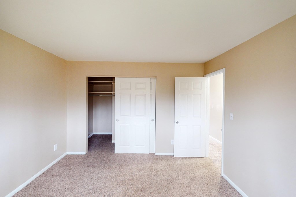 Bedroom with window light and bath at Sharondale Woods Apartments, Cincinnati, OH