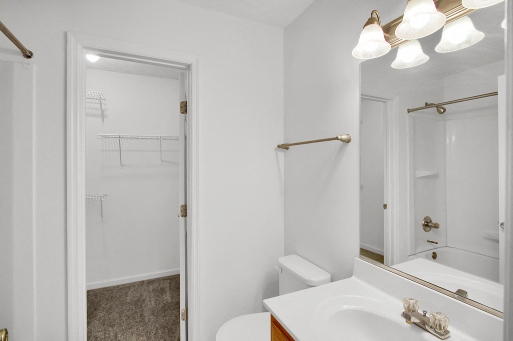 a bathroom with a sink and a shower and a mirror  at Aberdine Place, Georgetown