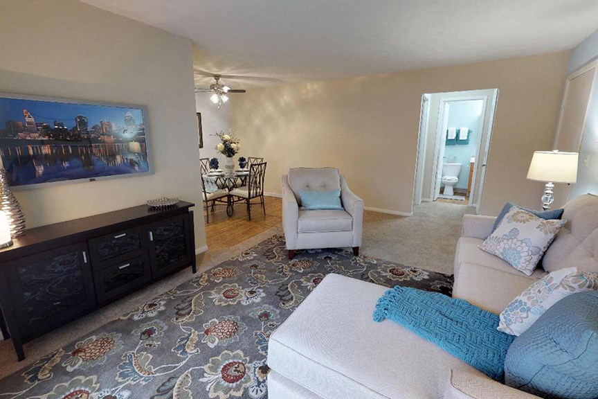 a living room with a couch and a chair and a rug  at Hunter's Creek Apartments, Ohio, 45242