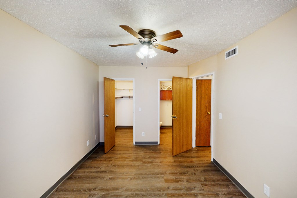 Bedroom with ceiling fan and light at Quail Meadow Apartments, Cincinnati, OH