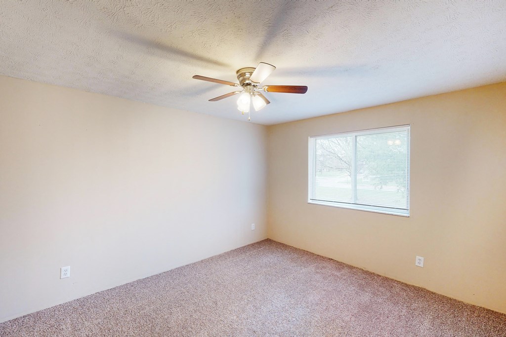Ceiling fan and light in bedroom at Quail Meadow Apartments, Cincinnati