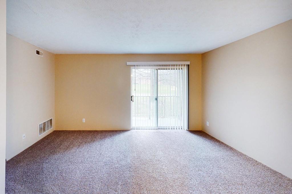 Living room with balcony at Quail Meadow Apartments, Ohio, 45240