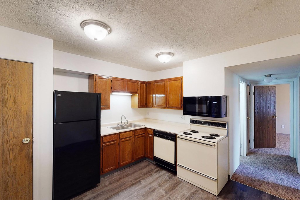 Wooden cabinets and black appliances1 at Quail Meadow Apartments, Cincinnati, 45240
