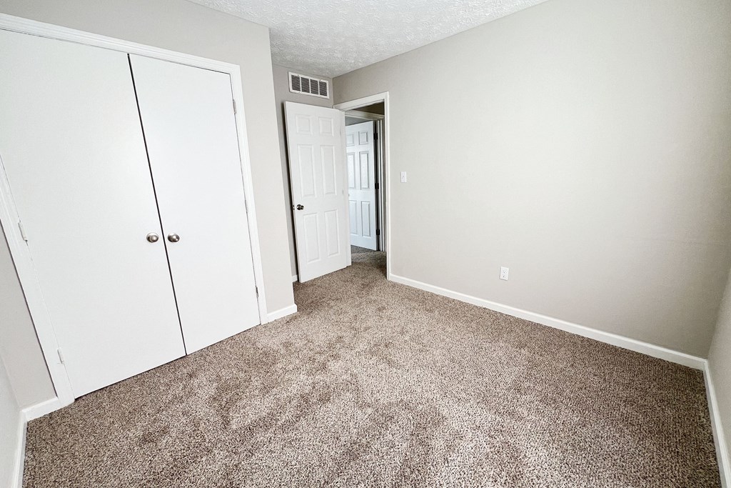 Bedroom with wooden floor at 450 on Keeneland Apartments, Kentucky