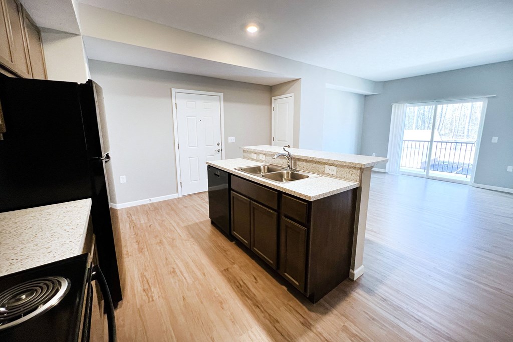 an empty kitchen and living room with wood flooring and  at Brookfield Village Apartments, Ohio, 43123