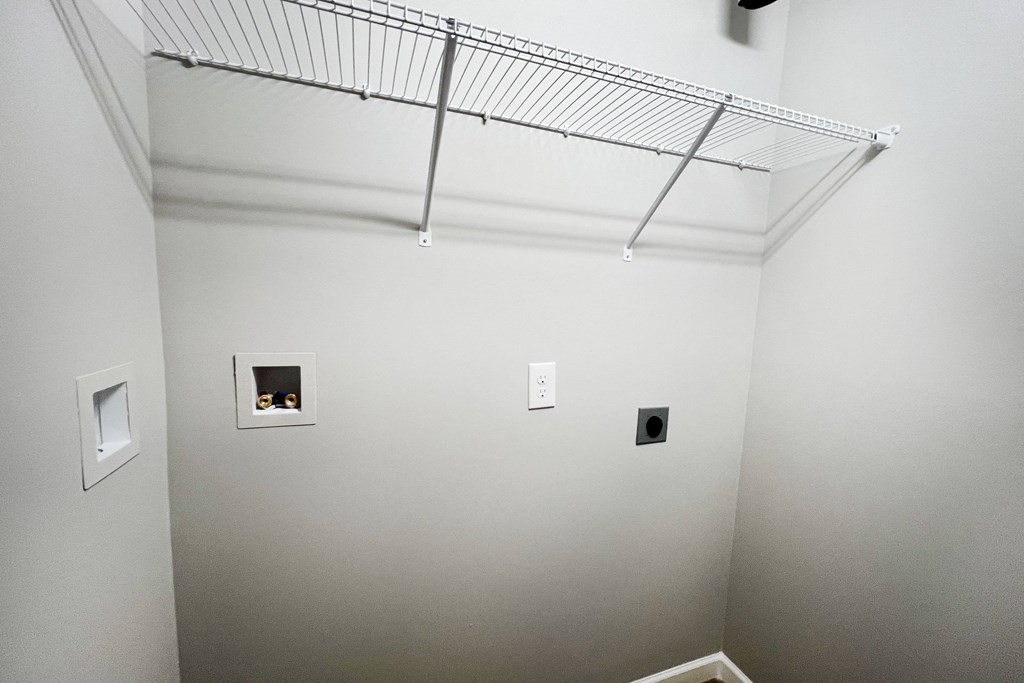 a room with white walls and a wire rack on the ceiling  at Brookfield Village Apartments, Ohio, 43123