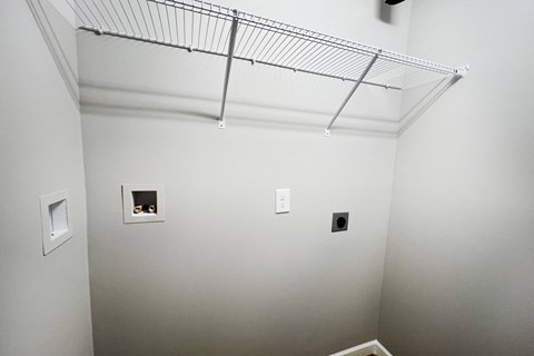a room with white walls and a wire rack on the ceiling  at Brookfield Village Apartments, Ohio, 43123